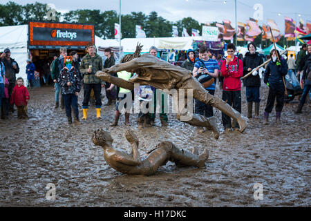 Friends mud wrestling at the 2015 Womad festival, Malmesbury, UK Stock ...