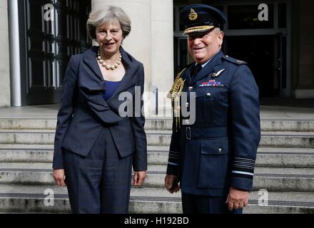 Prime Minister Theresa May meets the Chief of the Defence Staff Air Chief Marshal Stuart Peach outside the Ministry of Defence in London. Stock Photo