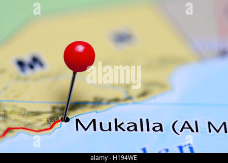 Mukalla pinned on a map of Yemen Stock Photo