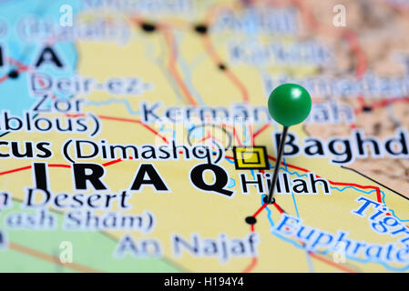 Hillah pinned on a map of Iraq Stock Photo