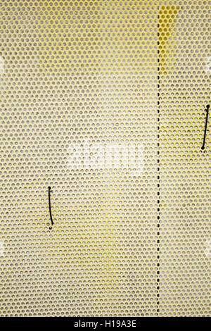 Yellow metal facade with circles, construction Stock Photo