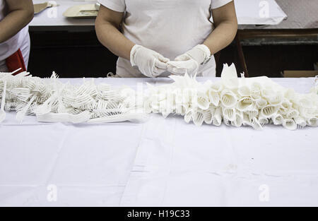 Worker preparing napkins in celebration, food Stock Photo