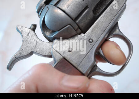 Finger on Trigger of Gun Stock Photo