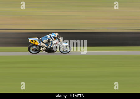 Donington Park, Derbyshire, UK. 23rd September 2016. Panned shot of a fast-moving rider taking part in practice day before the ThundersportGB race weekend. Credit:  Peter Hatter/Alamy Live News Stock Photo