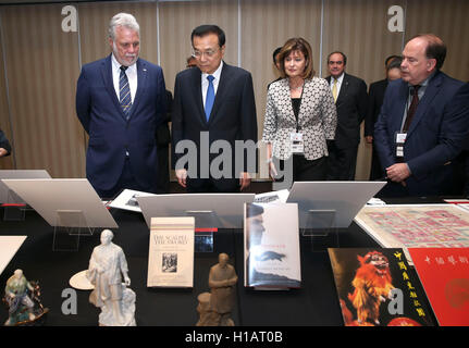 Montreal, Canada. 23rd Sep, 2016. Chinese Premier Li Keqiang (2nd L), accompanied by Quebec Premier Philippe Couillard (1st L), visits an exhibition featuring the China-Canada friendship and Norman Bethune prior to their meeting in Montreal, Canada, Sept. 23, 2016. Credit:  Pang Xinglei/Xinhua/Alamy Live News Stock Photo