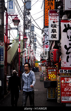 A sign-filled Shinjuku alleyway in Tokyo, Japan Stock Photo