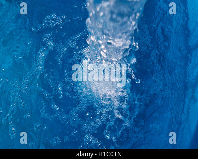 Water flowing, oxygenating air bubbles. Stock Photo