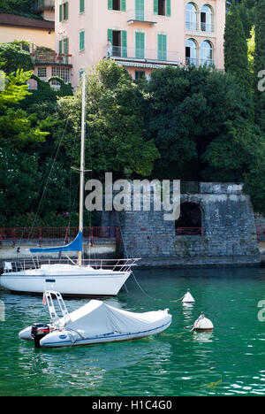 Varenna, Italy - September 4th, 2015: two white boats photographed in Varenna near Lake Como in North Italy Stock Photo