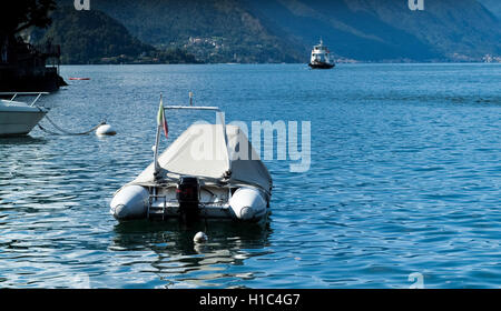 Varenna, Italy - September 4th, 2015: a covered boat photographed near Varenna, Lake Como, Italy Stock Photo