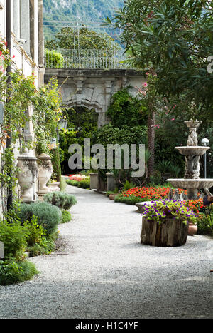 Varenna, Italy - September 4th, 2015: a path leading into the botanical garden at Villa Monastero in Varenna, Italy. Stock Photo