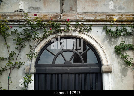 Varenna, Italy - September 4th, 2015: closeup photo of a black door at Villa Monastero in Varenna, Italy. Stock Photo