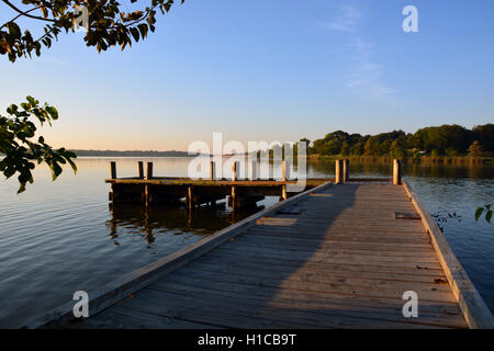 The sun rises over a fishing pier on White Rock Lake in Dallas Texas. Stock Photo