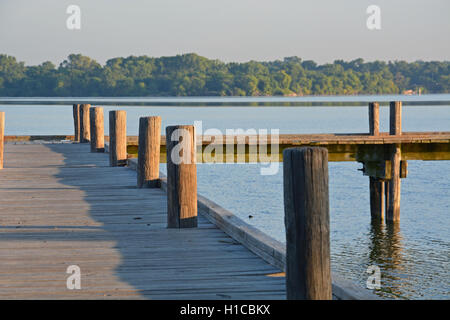 The sun rises over a fishing pier on White Rock Lake in Dallas Texas. Stock Photo