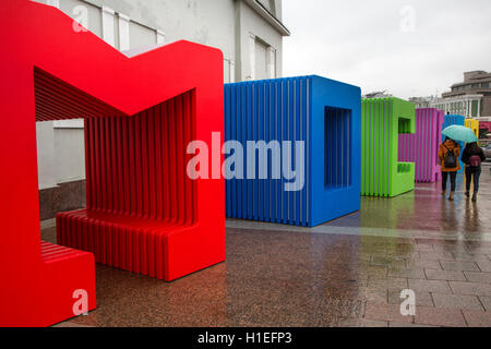 View of multi-colored capital letters 'Moscow' in downtown of Russian capital in the raining weather Stock Photo