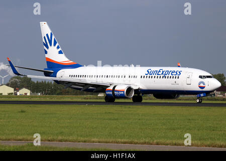 SunExpress Deutschland Boeing 737-800 touches down on runway 18R at Amsterdam Schipol airport. Stock Photo