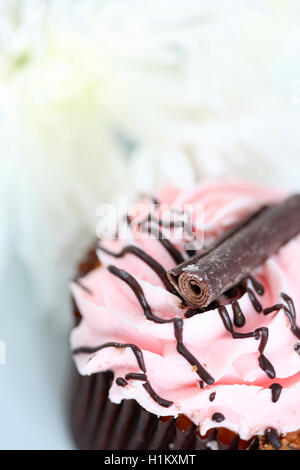 delicious cup cake with pink frosting Jane Ann Butler Photography JABPF037 Stock Photo