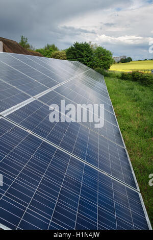 Kent, UK. An array of solar panels (PV or photo-voltaic) installed on a farm Stock Photo