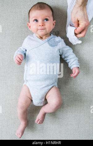 Oesophageal reflux of a 3 month old baby girl. Stock Photo