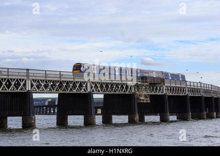 Tay Rail Bridge, north end, Dundee, Scotland, with a Scotrail diesel multiple unit  (DMU) crossing. Stock Photo