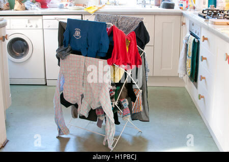 washing drying on an airer in kitchen Stock Photo