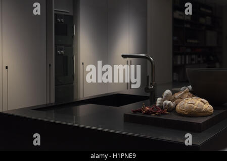 Cool and Classy, Modern and Stylish Kitchen with Black Granite Stone Worktop Stock Photo