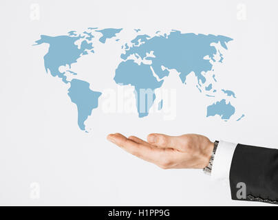 close up of businessman hand showing world map Stock Photo