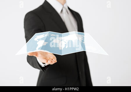 close up of businessman showing world map Stock Photo