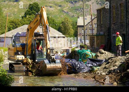 Hyundai HX140L crawler excavator clearing of the Glenridding Beck. Glenridding, The Lake District National Park, Cumbria, UK. Stock Photo