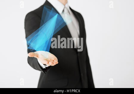 close up of businessman showing virtual hologram Stock Photo