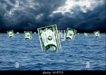 dollar banknotes sinking into ocean Stock Photo