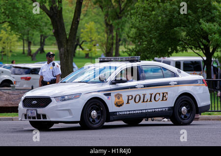 Washington D.C., USA - May 3, 2015: Police car and police were photographed in Washington D.C. They represent the law enforcement agency, Metropolitan Police Department of the District of Columbia. Stock Photo
