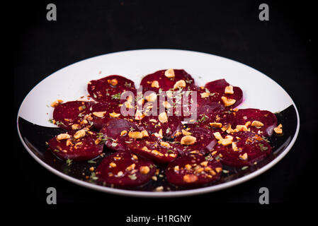 Roasted beet root salad with herbs and hazelnuts Stock Photo