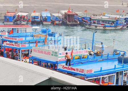 Nha Trang, Vietnam - July 13, 2015: Nha Trang, Vietnam - July 13, 2015: Boats are mooring at the dock Stock Photo