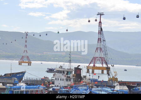 Nha Trang, Vietnam - July 13, 2015: Telpher are transfering travellers from the dock to island Stock Photo