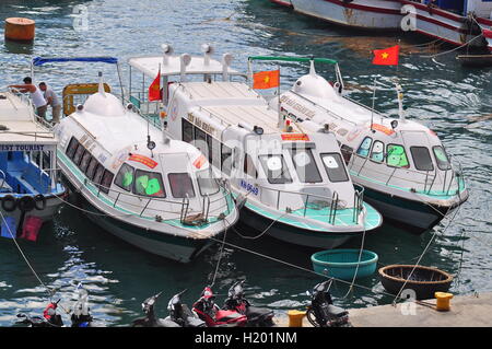 Nha Trang, Vietnam - July 13, 2015: Nha Trang, Vietnam - July 13, 2015: Boats are mooring at the docks Stock Photo