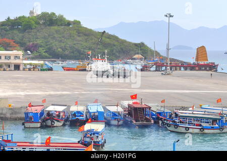 Nha Trang, Vietnam - July 13, 2015: Nha Trang, Vietnam - July 13, 2015: Boats are transfering travellers from the dock to island Stock Photo