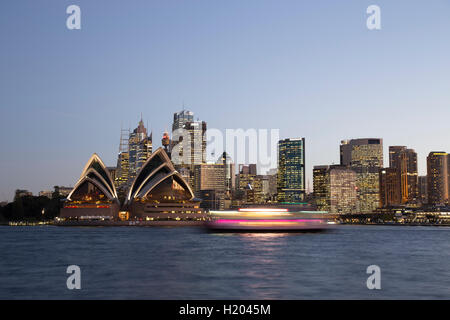 Blurred ferry passes in front of Sydney Opera House Sydney Australia Stock Photo