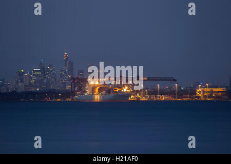 Container Ship unloading at Port Botany Container Wharf Sydney NSW Australia in the early evening. Stock Photo