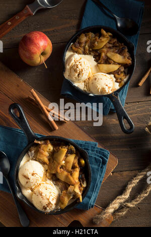 Homemade Sauteed Cinnamon Sugar Apples with Ice Cream Stock Photo