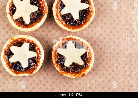 Holiday mince pies with star shape, viewed from above with copy space. Stock Photo