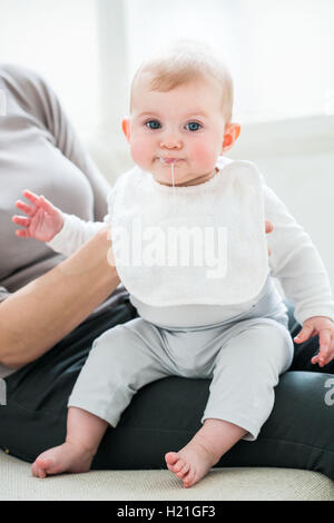 Oesophageal reflux of a 6 month-old baby girl. Stock Photo