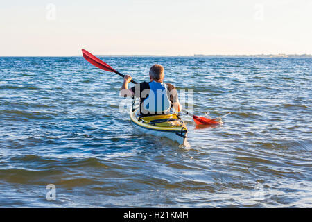 Denmark, senior man paddling, kayak Stock Photo