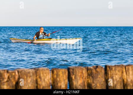 Denmark, senior man paddling, kayak Stock Photo