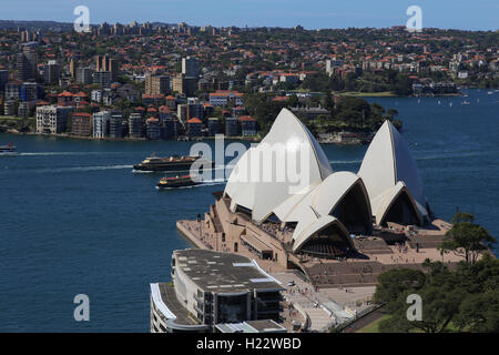 Aerial view of Sydney harbour ferries passing Sydney Opera House New South Wales Australia Stock Photo