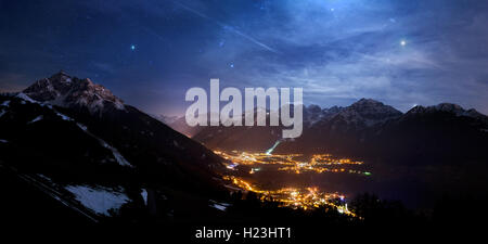 Night scene, lighted places Fulpmes, Mieders and Neustift, left mountain Serles, behind Schlick ski area, Stubai Alps Stock Photo