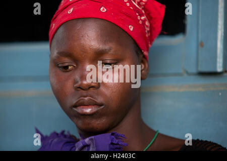 Ribaue Hospital,  Ribaue, Nampula Province, Mozambique, August 2015: . Laurinda Diago's eldest daughter Aide Victorino is here at the hospital to support her mother who has bilateral cataracts. Stock Photo