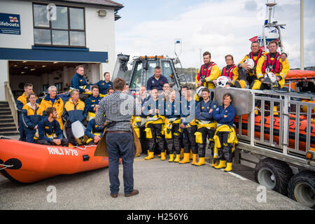 Aberystwtyth, Wales, UK. 24th Sep, 2016. Photographer JACK LOWE, grandson of ‘Dad's Army' actor Arthur Lowe, at Aberystwyth RNLI station photographing the crew and boats as part of his massive 5 year long project to document all 237 RNLI lifeboat stations in the UK, using an antique ‘plate' camera and the ‘wet collodion' process on 12”x10” glass negatives. Each negative has to be prepared by hand just before the photo is made, and he then has about 12 minutes to make the exposure and develop the image, which he does in an old ambulance he's converted into a mobile darkroom. © keith morris/Alam Stock Photo