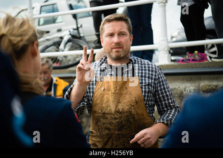 Aberystwtyth, Wales, UK. 24th Sep, 2016. Photographer JACK LOWE, grandson of ‘Dad's Army' actor Arthur Lowe, at Aberystwyth RNLI station photographing the crew and boats as part of his massive 5 year long project to document all 237 RNLI lifeboat stations in the UK, using an antique ‘plate' camera and the ‘wet collodion' process on 12”x10” glass negatives. Each negative has to be prepared by hand just before the photo is made, and he then has about 12 minutes to make the exposure and develop the image, which he does in an old ambulance he's converted into a mobile darkroom. © keith morris/Alam Stock Photo