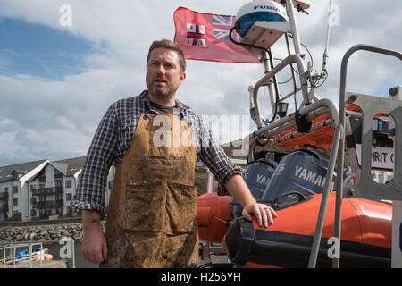 Aberystwtyth, Wales, UK. 24th Sep, 2016. Photographer JACK LOWE, grandson of ‘Dad's Army' actor Arthur Lowe, at Aberystwyth RNLI station photographing the crew and boats as part of his massive 5 year long project to document all 237 RNLI lifeboat stations in the UK, using an antique ‘plate' camera and the ‘wet collodion' process on 12”x10” glass negatives. Each negative has to be prepared by hand just before the photo is made, and he then has about 12 minutes to make the exposure and develop the image, which he does in an old ambulance he's converted into a mobile darkroom. © keith morris/Alam Stock Photo