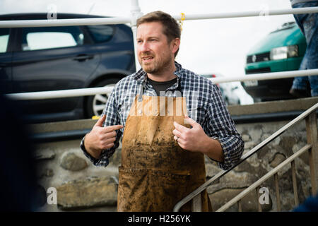 Aberystwtyth, Wales, UK. 24th Sep, 2016. Photographer JACK LOWE, grandson of ‘Dad's Army' actor Arthur Lowe, at Aberystwyth RNLI station photographing the crew and boats as part of his massive 5 year long project to document all 237 RNLI lifeboat stations in the UK, using an antique ‘plate' camera and the ‘wet collodion' process on 12”x10” glass negatives. Each negative has to be prepared by hand just before the photo is made, and he then has about 12 minutes to make the exposure and develop the image, which he does in an old ambulance he's converted into a mobile darkroom. © keith morris/Alam Stock Photo